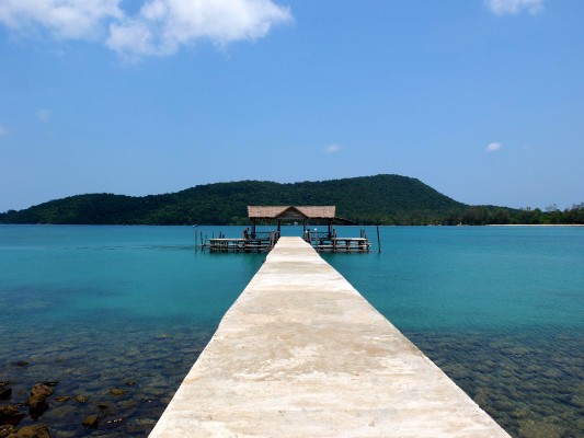 Jetty into blue sea